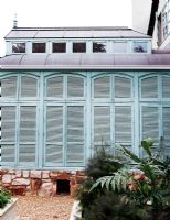 Exterior of conservatory with shutters 