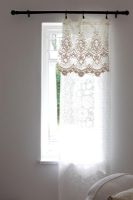 Lace curtain at window