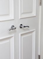 White door with chrome handles, detail