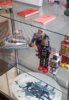 Vintage toys in glass display cabinet 