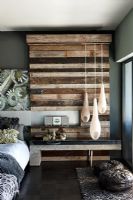 Modern bedroom with wooden feature wall