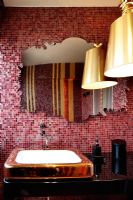 Modern bathroom sink with mosaic feature wall