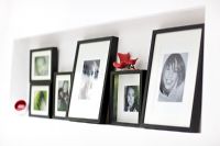 Collection of framed photographs, detail
