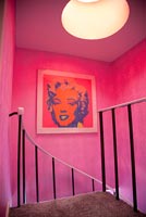 Pink hallway with Andy Warhol print