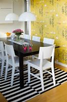 Dining table on black and white rug