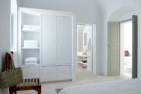 Modern wardrobe and shelves in bedroom