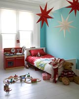 Childs room with star shaped lanterns