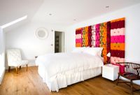 Bedroom with colourful headboard