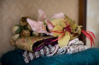 Collection of fabric flowers and scarves