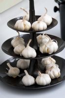 Contemporary cake stand with garlic bulbs
