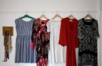 Collection of vintage dresses hanging up