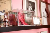 High heel boot in glass display case 