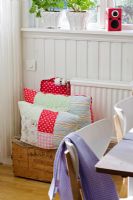 Patchwork cushions in country dining room