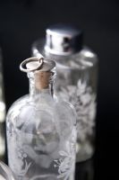 Detail of ornate glass perfume bottles 