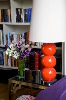 Red lamp on side table
