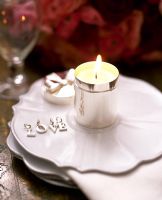 Tea light on ornate plate