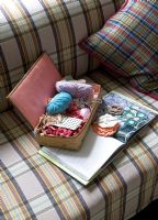 Needlework box on tartan sofa