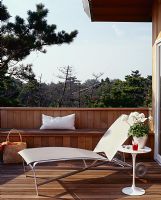 Sun lounger on modern decked terrace 