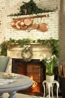 Christmas decorations over classic fireplace 