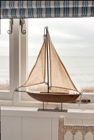 Model boat on windowsill 