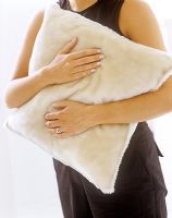 Woman holding cushion 
