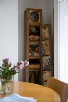 Eclectic shelving unit in modern dining room 