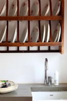 Wall mounted plate rack in modern kitchen 