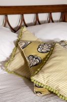 Detail of cushions on bed  