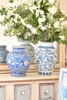 Pair of ceramic vases and flowers 