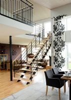 Central staircase in modern open plan area
