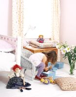 Little girl playing in classic bedroom 