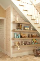 Display of items on under stair shelving 