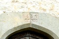 Date carved into stone arch above front door