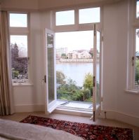 Open french windows with river views 