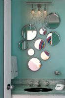 Display of mirrors over bathroom sink 