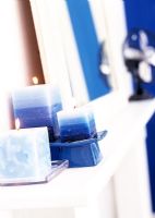 Blue candles on mantelpiece 