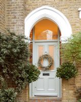 Christmas wreath on classic front door 