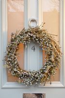 Detail of Christmas wreath on front door 