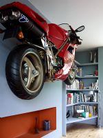Wall mounted motorbike in modern living room 
