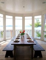 Country dining room with views over lake 