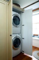 Washing machine and dryer in cupboard 