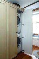 Washing machine and dryer in cupboard 