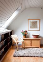 Chair in modern living room with curved ceiling