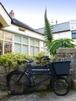 Classic delivery bicycle outside country house