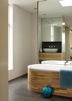 Luxury bathroom with wooden clad bath