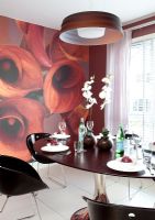 Modern black, red and white dining room with feature wall