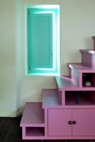 Pink staircase with storage