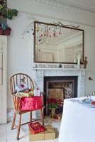 Armchair with Christmas presents in dining room