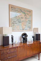 Vintage sideboard with African map and artefacts