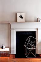 Classic fireplace with modern artwork